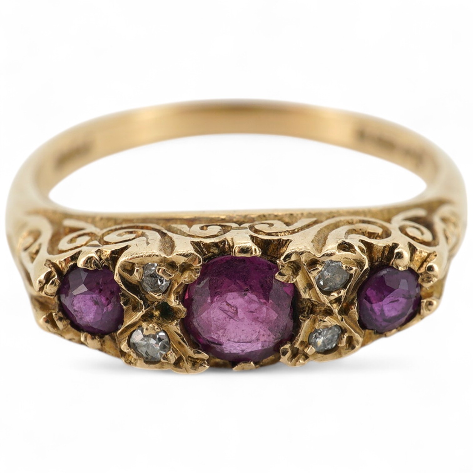 A 1960's 9ct gold ruby and diamond cluster set half hoop ring, size P, gross weight 3.1 grams.